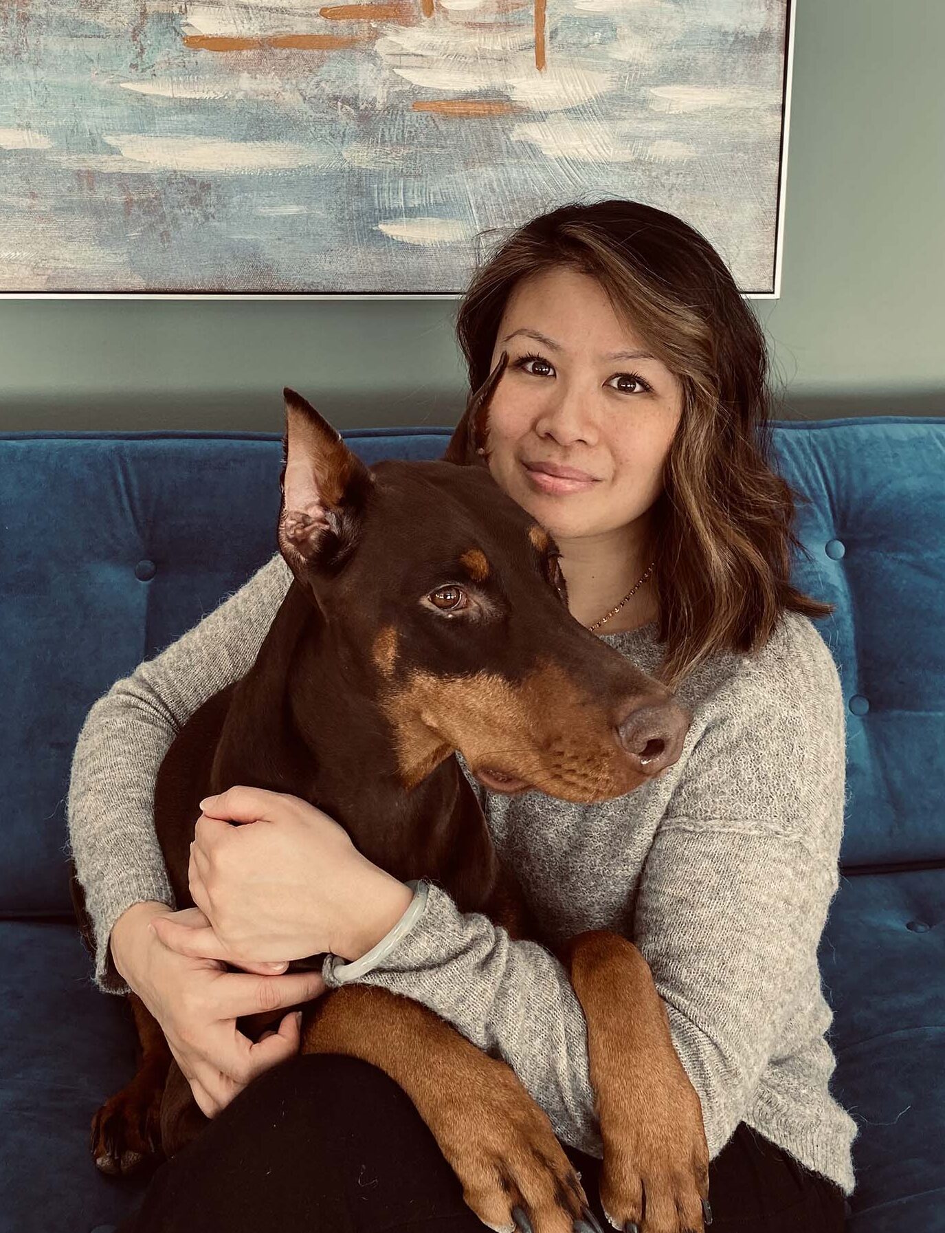 Neurodivergent affirming therapist holding dog in Oshawa Durham office